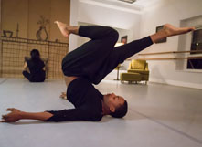 dancer Charles Williams stretching before a performance.